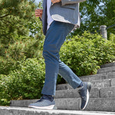 model wearing The Hybrid Cobalt running on stairs