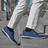 model walking up stairs wearing The Original Cobalt