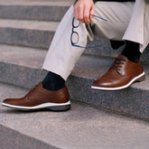 Model wearing The OG Coffee with light dress pants and dark socks