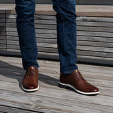 Model wearing The Original Coffee paired with blue jeans