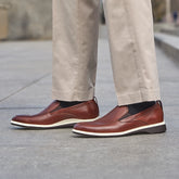 Model wearing The Slip On Coffee paired with light dress pants