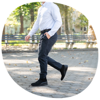 The Boot in Midnight by Amberjack - on model walking wearing business casual outfit